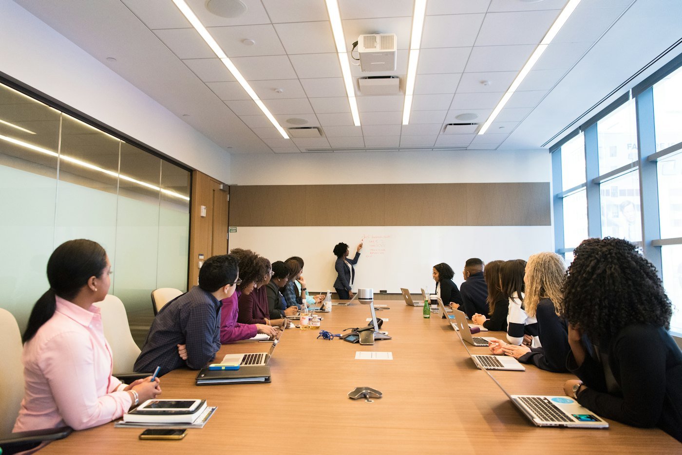 Advisors meeting around a conference table with a client