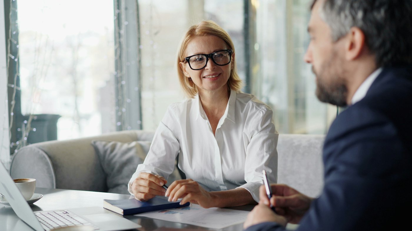 Advisor and client reviewing information together at a laptop