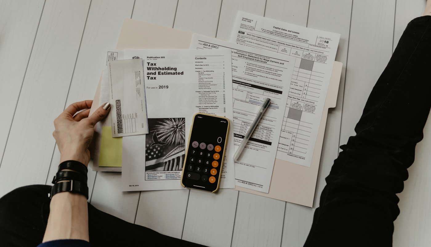 Paperwork, pen and calculator for tax planning
